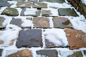 Natural stone during winter covered in snow